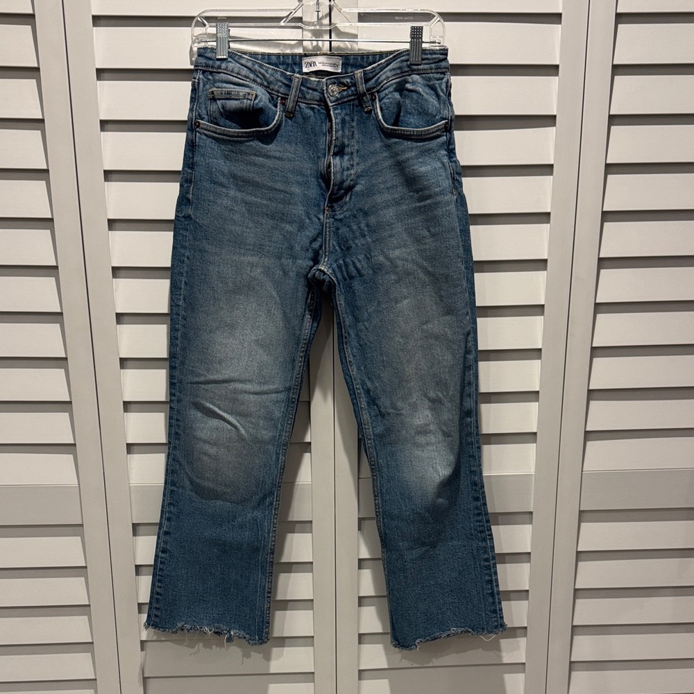 Zara Women's Blue Flare Jeans with raw hem.